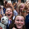 Fans celebrates as members of the U.S. women's soccer team pass by during a ticker-tape parade in New York City, July 10, 2019.