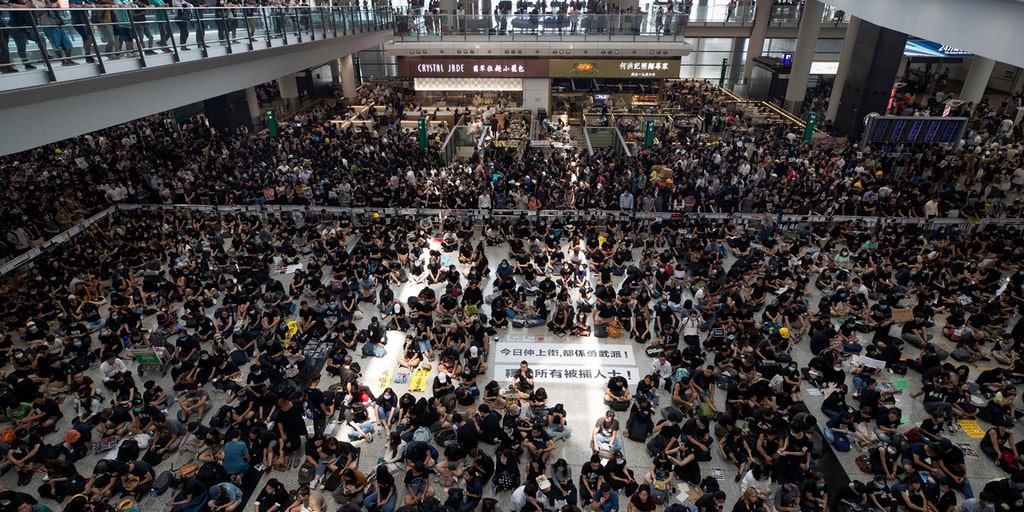 Hong Kong International Airport continues to see delays as thousands of protesters occupy terminals for a fifth day