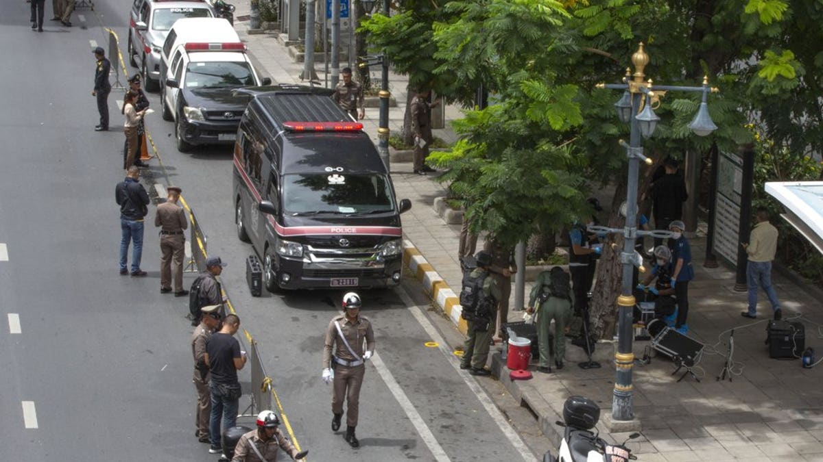 Thai investigators cordon-off an area in which an explosion injured people in Bangkok, Thailand, Friday, Aug. 2, 2019. Thai Prime Minister Prayuth Chan-o-cha on Friday ordered an investigation into several small bombings in Bangkok that took place as Thailand was hosting a high-level meeting attended by U.S. Secretary of State Mike Pompeo and his counterparts from China and several Asia-Pacific countries.