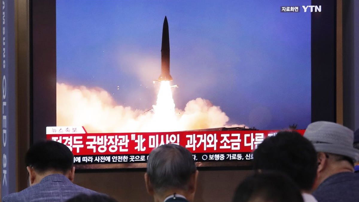 People watch a TV showing a file image of North Korea's missile launch during a news program at the Seoul Railway Station in Seoul, South Korea, Wednesday, July 31, 2019. (Associated Press)