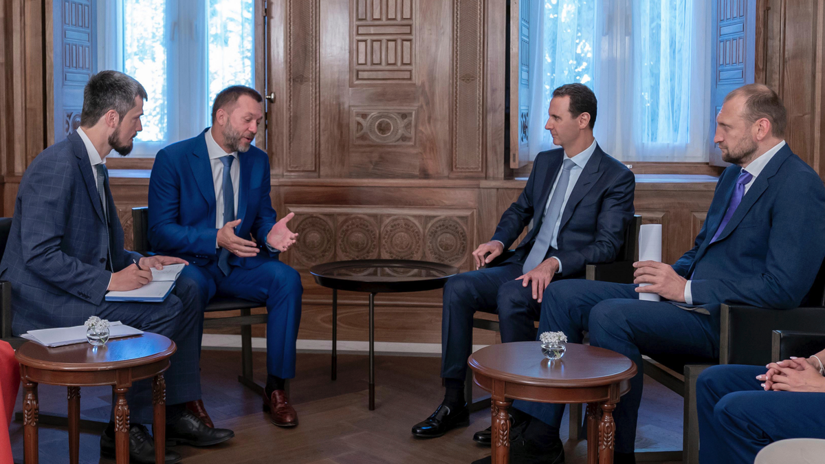 Syrian President Bashar Assad, second right, meets with a Russian delegation in Damascus, Syria, Aug. 20, 2019. (SANA via AP)