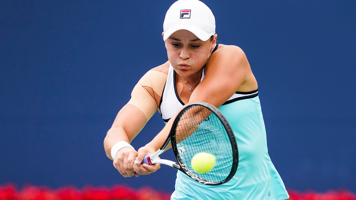 Ashleigh Barty, of Australia, returns a shot to Sofia Kenin, of the United States, during the Rogers Cup women’s tennis tournament Tuesday, Aug. 6, 2019, in Toronto. (Mark Blinch/The Canadian Press via AP)