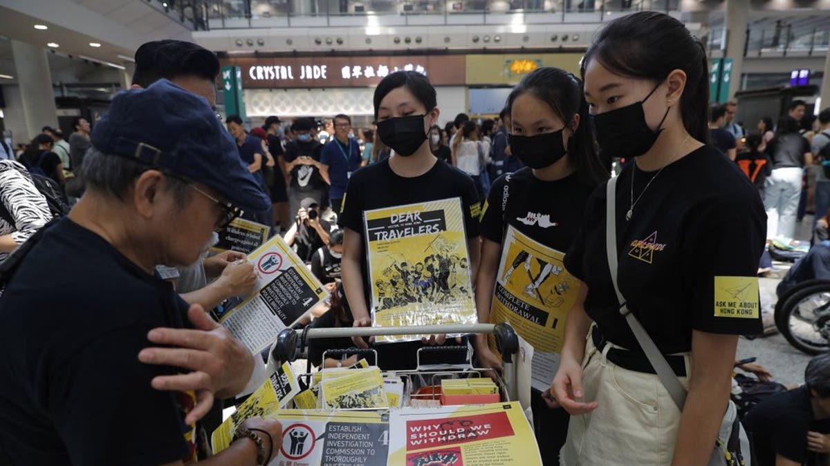 Protesters promote their cause at the airport In Hong Kong on Friday, Aug. 9, 2019. Pro-democracy protesters held a demonstration at Hong Kong's airport Friday even as the city sought to reassure visitors to the city after several countries issued travel safety warnings related to the increasing levels of violence surrounding the two-month-old protest movement.