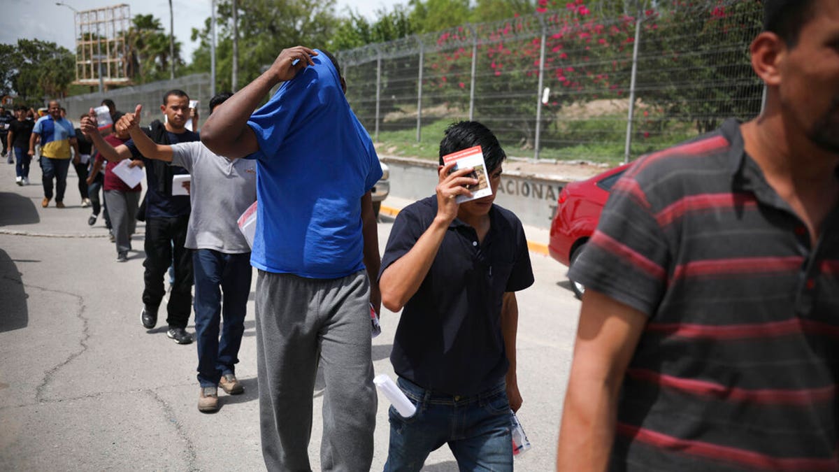 Migrants return to Mexico from the Brownsville, Texas Port of Entry last week. (AP Photo/Emilio Espejel, File)