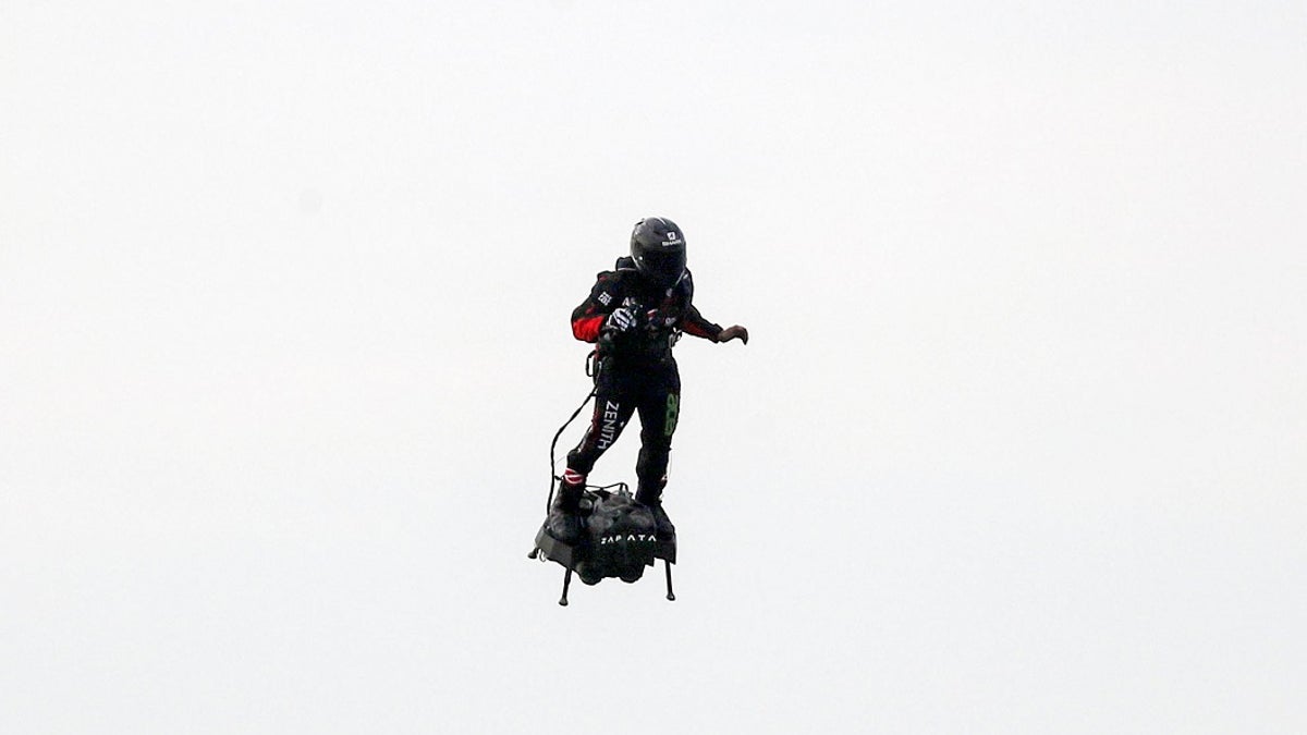 French inventor Franky Zapata prepares to land near St. Margaret's beach, Dover Sunday, Aug. 4, 2019. Zapata has successfully flown over the English Channel on a personal flying machine. (Steve Parsons/PA via AP)