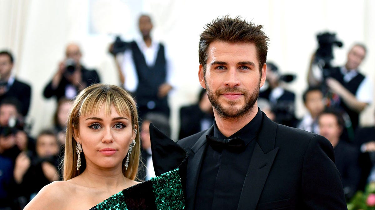 Miley Cyrus, left, and Liam Hemsworth attend the Metropolitan Museum of Art's Costume Institute benefit gala in New York, May 6, 2019. (Associated Press)