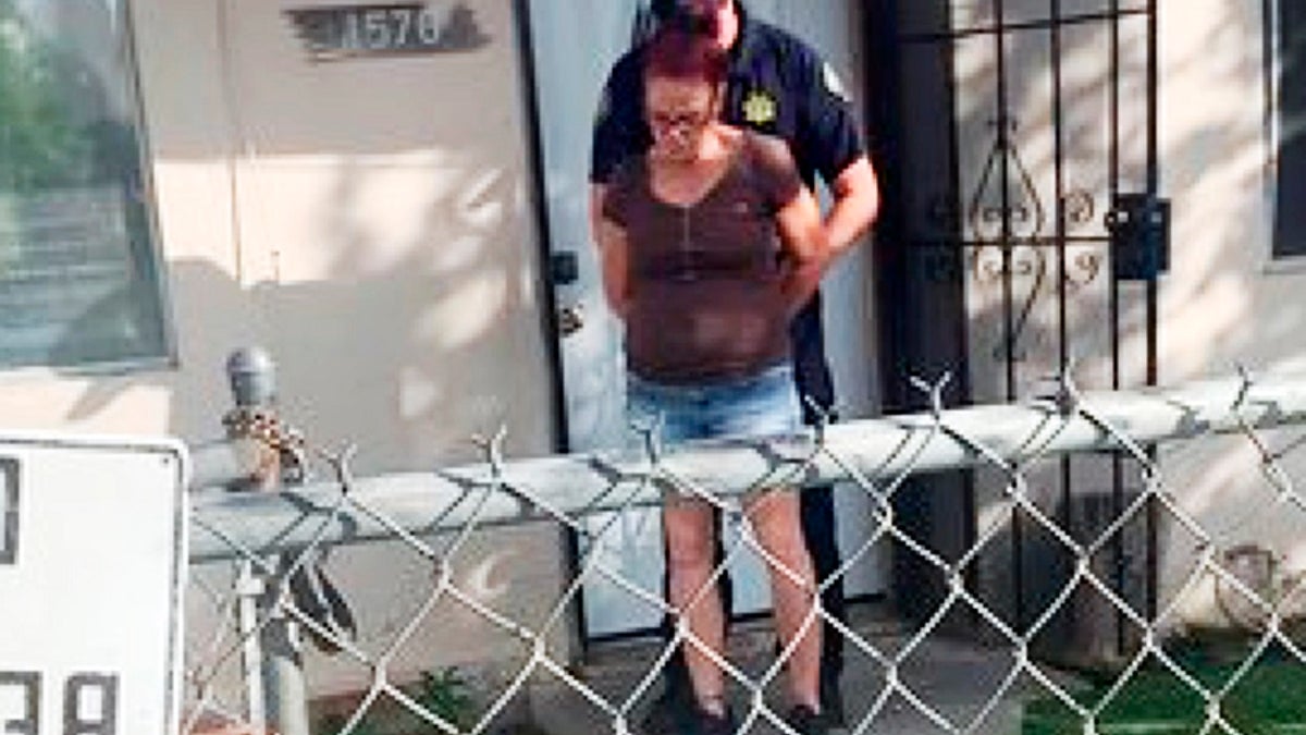 This April 22 photo by a Riverside County Animal Services officer shows the arrest of Deborah Sue Culwell at her Coachella, Calif., home. (Riverside County Animal Services via AP, File)