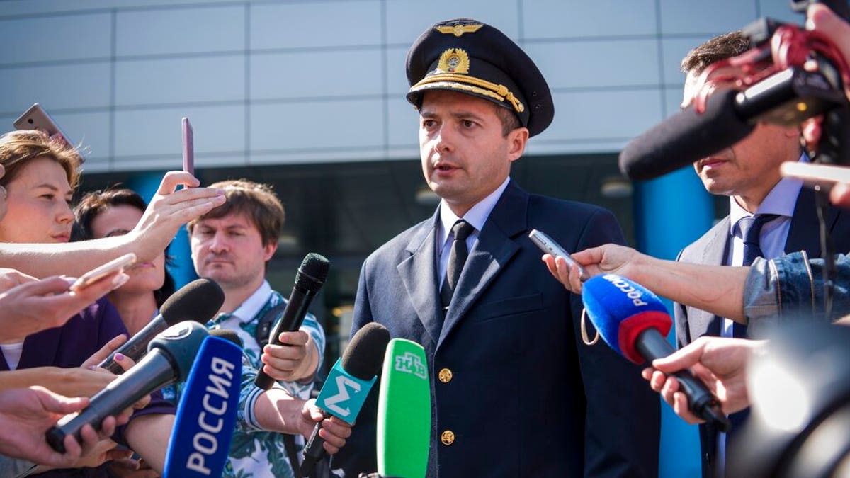 Damir Yusupov, 41-year-old Russian pilot, speaks to the media in Yekaterinburg, Russia, Friday, Aug. 16, 2019. 