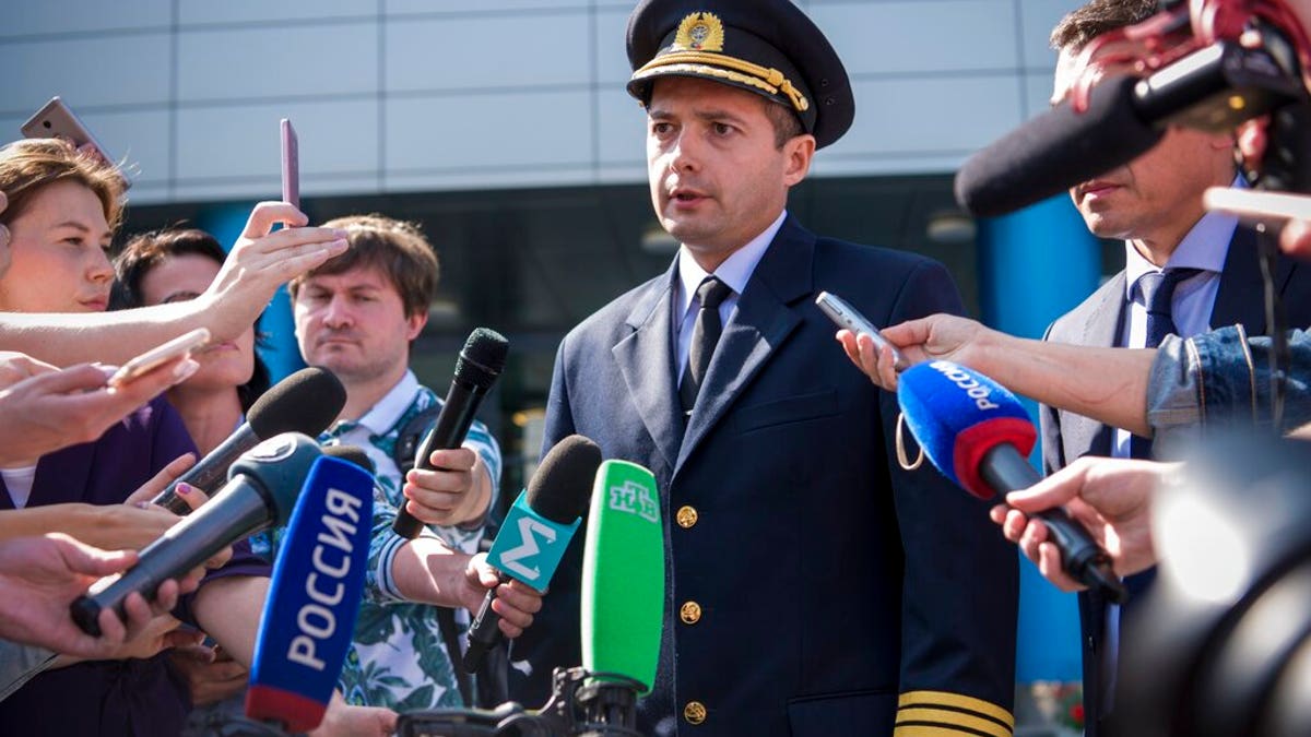 Damir Yusupov, 41-year-old Russian pilot, speaks to the media in Yekaterinburg, Russia, Friday, Aug. 16, 2019.