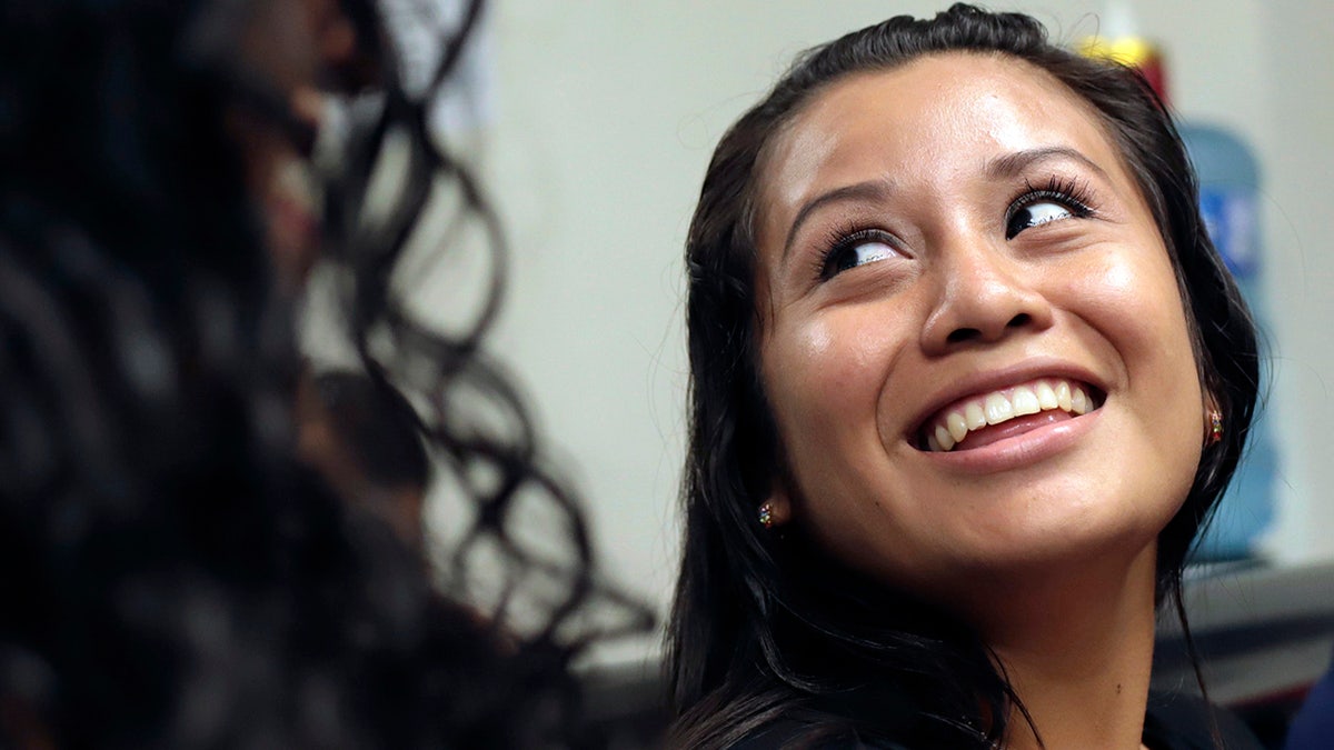 Evelyn Hernandez, 21, smiles in court after being acquitted on charges of aggravated homicide in her retrial related to the loss of a pregnancy in 2016, in Ciudad Delgado on the outskirts of San Salvador, El Salvador, Monday, Aug. 19, 2019. 