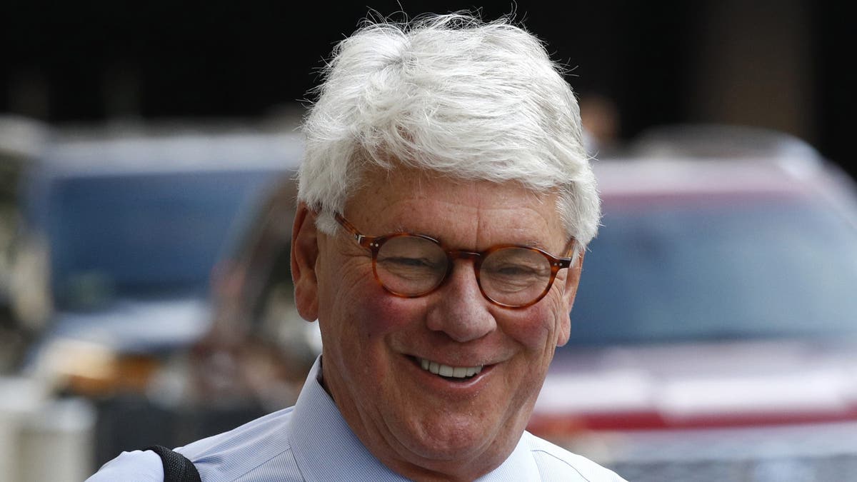 Greg Craig, former White House counsel to former President Barack Obama, walks into a federal courthouse for his trial, Thursday, Aug. 22, 2019, in Washington. (AP Photo/Patrick Semansky)