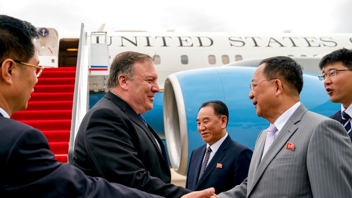In this July 6, 2018, file photo, U.S. Secretary of State Mike Pompeo, second from left, is greeted by North Korean Director of the United Front Department Kim Yong Chol, center, and North Korean Foreign Minister Ri Yong Ho, second from right, as he arrives at Sunan International Airport in Pyongyang, North Korea.