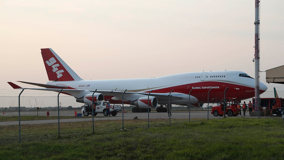 A Boeing 747-400 Global SuperTanker, stands on the tarmac before it starts firefighting operations, at the Viru Viru airport in Santa Cruz, Bolivia, Friday, Aug. 23, 2019. Bolivia, along with Brazil, is struggling to contain wildfires, many believed to have been set by farmers clearing land for cultivation. (AP Photo/Juan Karita)