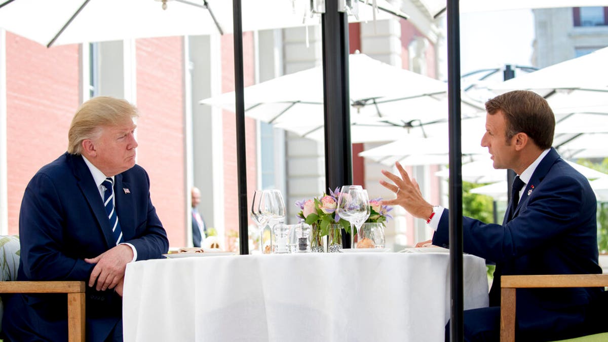 U.S President Donald Trump sits for lunch with French President Emmanuel Macron, right, at the Hotel du Palais in Biarritz, south-west France, Saturday Aug. 24, 2019. Efforts to salvage consensus among the Group of Seven rich democracies on the economy, trade and environment were fraying around the edges even as leaders were arriving before their three-day summit in southern France. 