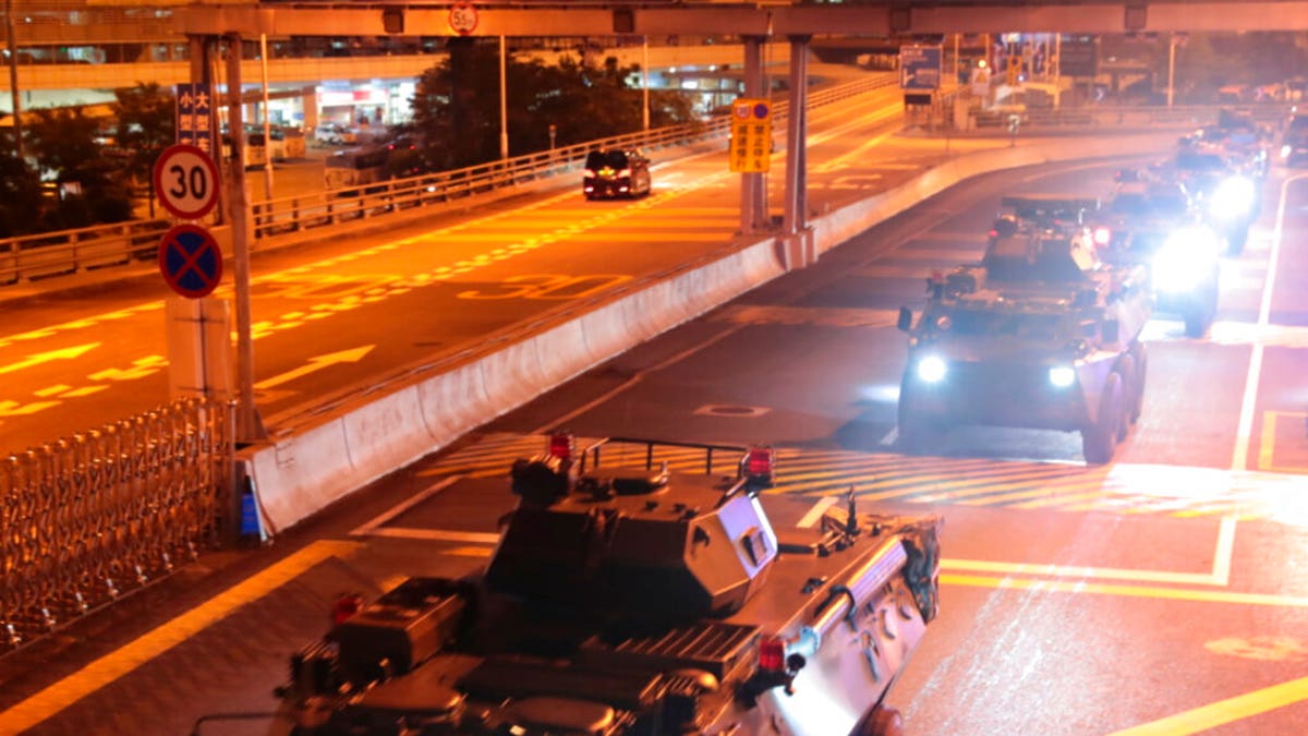 Armored personnel carriers of China's People's Liberation Army (PLA) pass through the Huanggang Port border between China and Hong Kong, Thursday, Aug. 29, 2019.