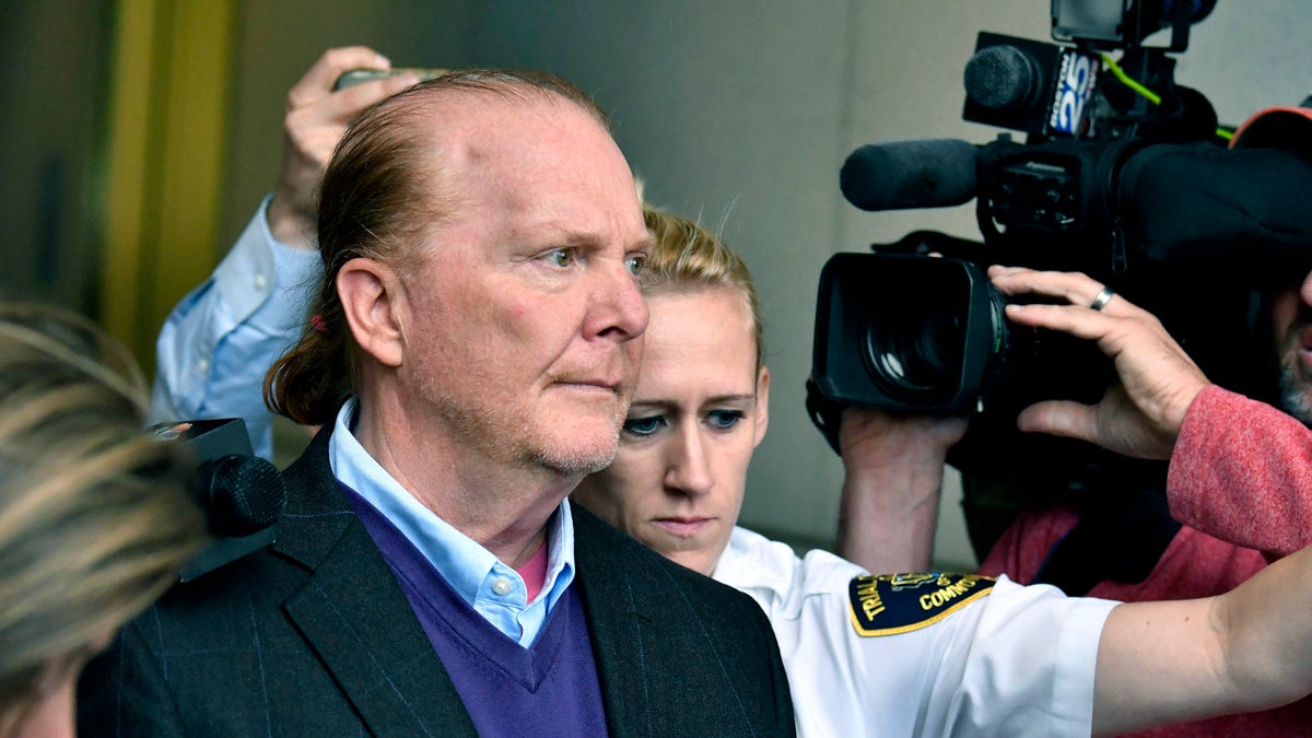 Celebrity chef Mario Batali departs a municpal court in Boston in May 2019, after pleading not guilty to allegations that he forcibly kissed and groped a woman at a Boston restaurant in 2017. (AP)