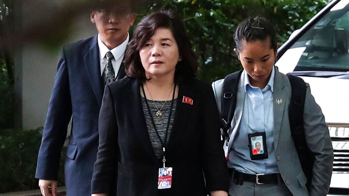 In this June 11, 2018, file photo, North Korean Vice Foreign Minister Choe Son Hui, center, arrives for a meeting with U.S. Ambassador to the Philippines Sung Kim at the Ritz-Carlton Millenia Hotel in Singapore ahead of the summit between U.S. President Donald Trump and North Korean leader Kim Jong Un. 