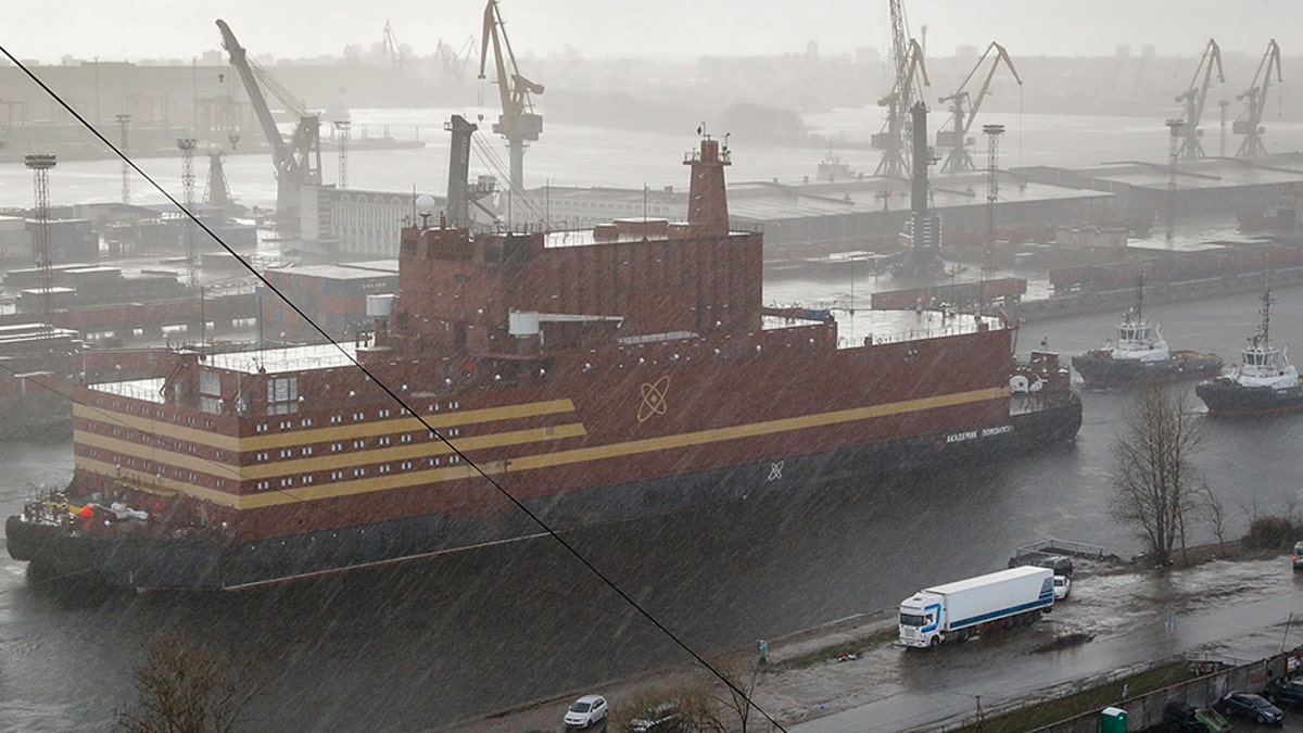 The floating nuclear power plant Akademik Lomonosov is towed out of the shipyard where it was constructed in St. Petersburg, Russia, in April 2018. (AP)
