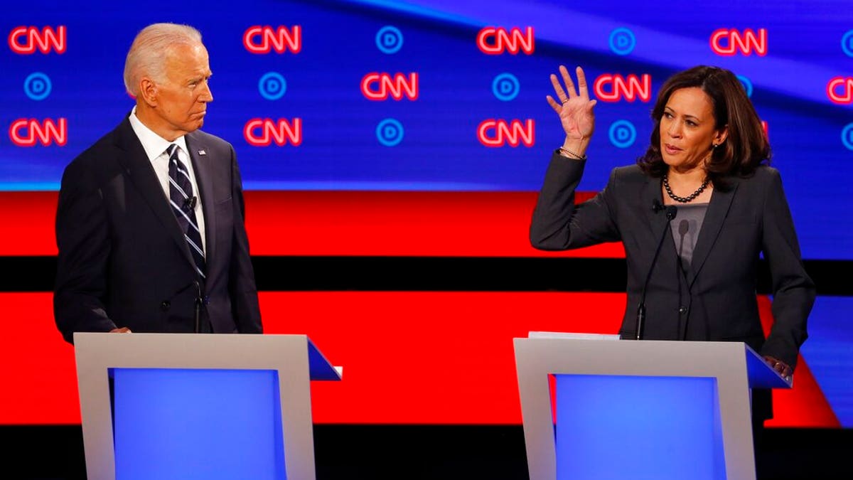 Sen. Kamala Harris, D-Calif., speaks as former Vice President Joe Biden listens during the second of two Democratic presidential primary debates hosted by CNN Wednesday, July 31, 2019, in the Fox Theatre in Detroit. (AP Photo/Paul Sancya)