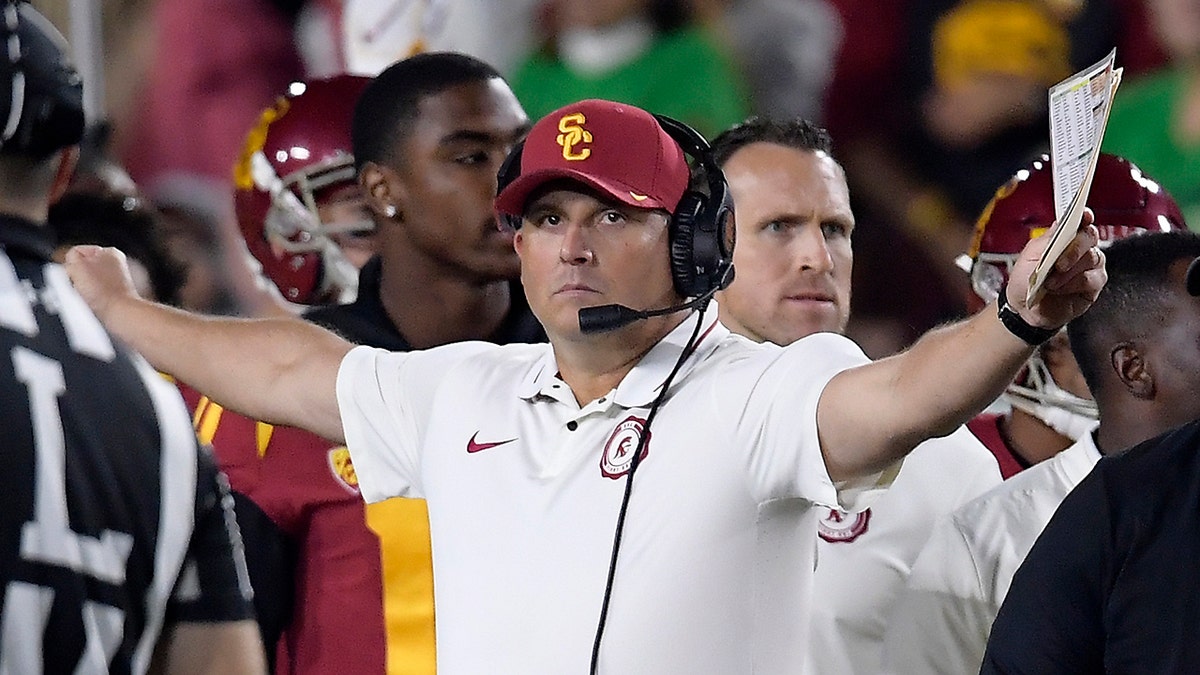 FILE - In this Nov. 24, 2018, file photo, Southern California head coach Clay Helton gestures during the first half of an NCAA college football game against Notre Dame in Los Angeles. Helton went 21-6 with a Rose Bowl victory and Pac-12 title in his first two full seasons as USC coach, but his job status is one of the stories of the 2019 season. (AP Photo/Mark J. Terrill, File)