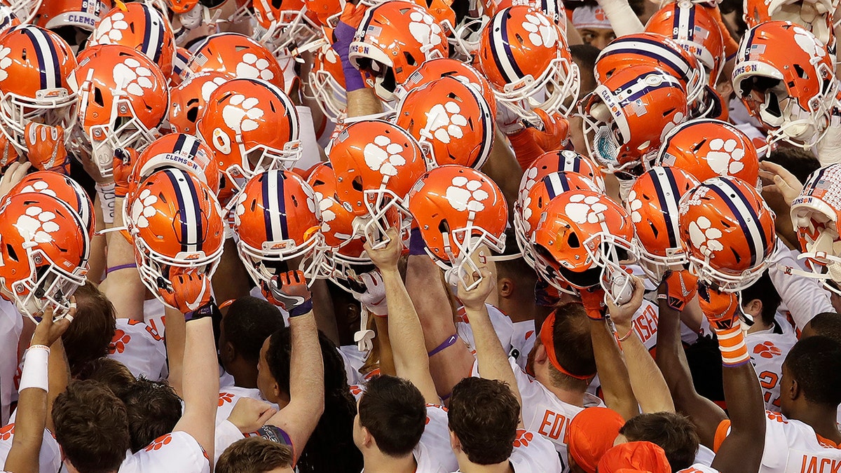 In this Jan. 7, 2019, file photo, Clemson players huddle before the NCAA college football playoff championship game against Alabama, in Santa Clara, Calif. (AP Photo/Jeff Chiu, File)
