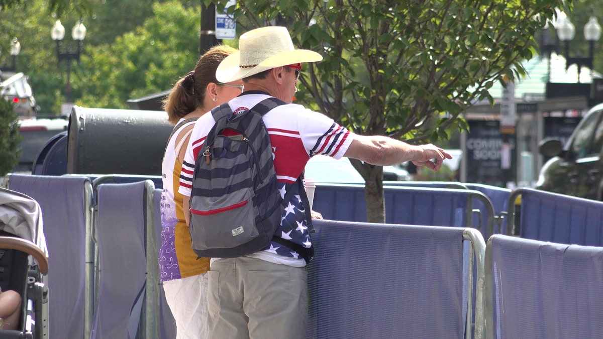 Carlos Arredondo and his wife Malida inspect the work underway on the memorial near the finish line.