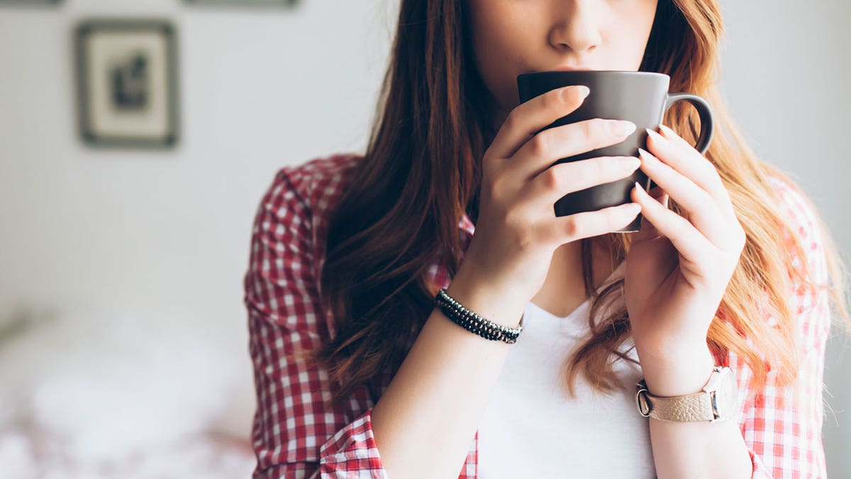 woman drinking coffee