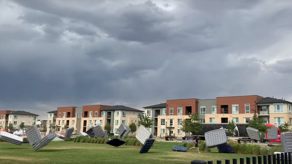 Video from Robb Manes shows dozens of mattresses tumbling across a grassy park in Denver's Stapleton neighborhood on Saturday.