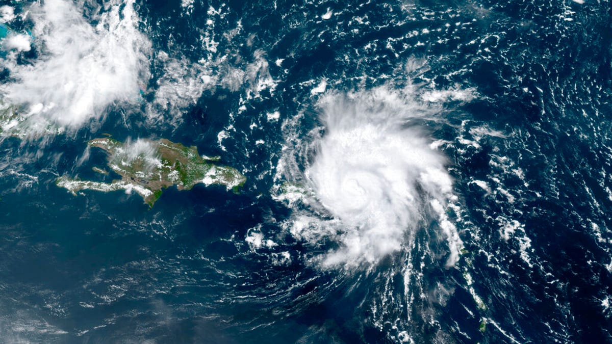 This GOES-16 satellite image taken Wednesday, Aug. 28, 209, at 17:20 UTC and provided by National Oceanic and Atmospheric Administration (NOAA), shows Dorian, a Category 1 hurricane, crossing over the U.S. and British Virgin Islands. Forecasters say it could grow to Category 3 status as it nears the U.S. mainland as early as the weekend. (NOAA via AP)