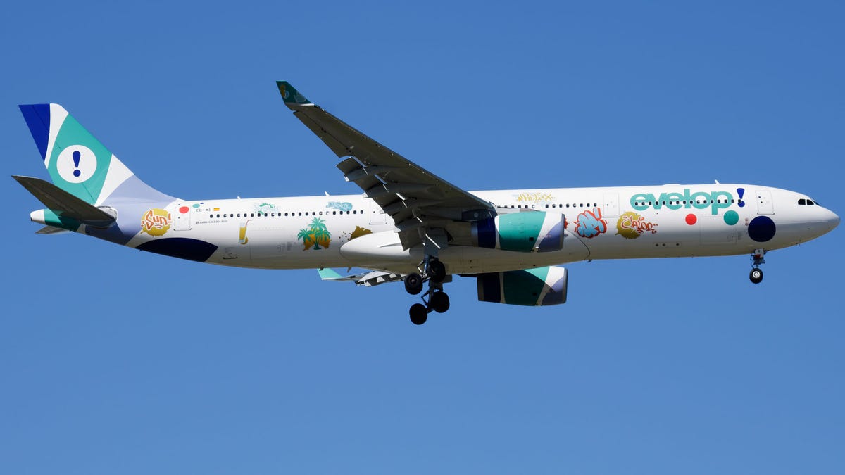 Evelop Airlines special livery Airbus A330-300 EC-MII passenger plane landing at Madrid Barajas Airport