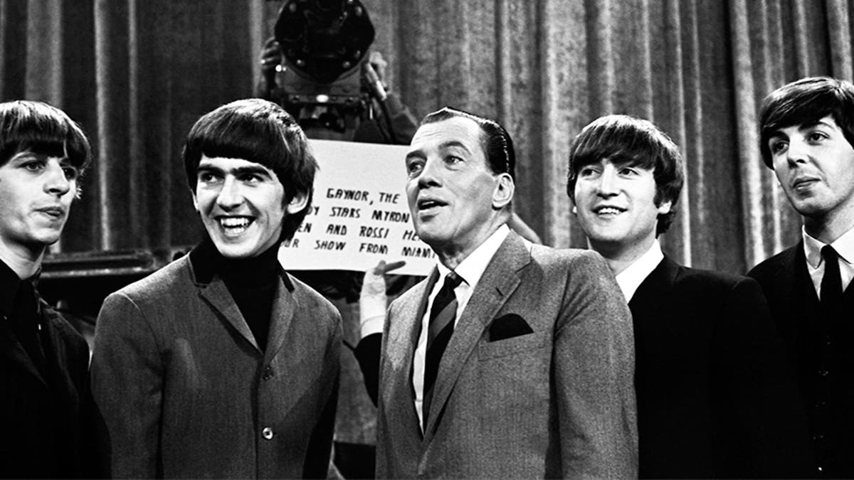 Ed Sullivan with The Beatles, before the group's second appearance on 'The Ed Sullivan Show' on Feb.y 16, 1964 at the Deauville Hotel in Miami Beach, Fla. (Photo by Jeff Hochberg/Getty Images)