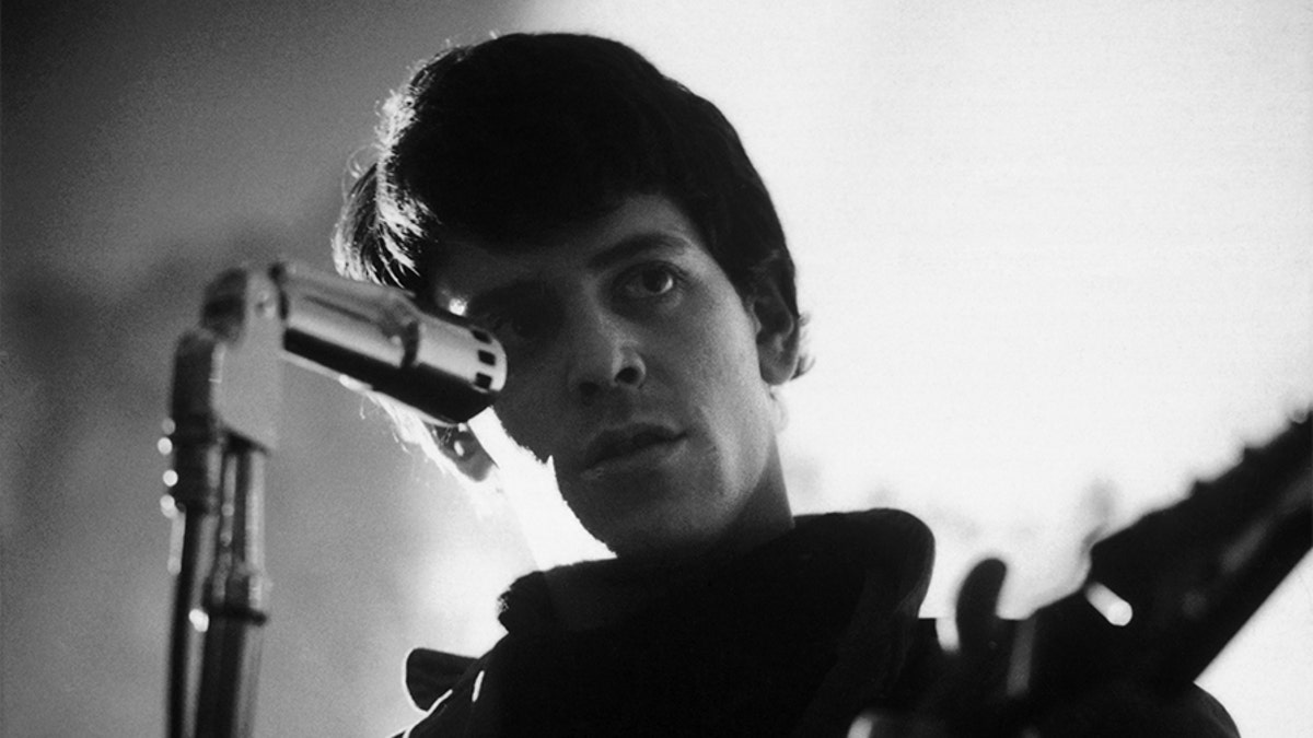 Lou Reed of the Velvet Underground performs on stage at the New York Society for Clinical Psychiatry annual dinner, The Delmonico Hotel, New York, 13th January 1966. (Photo by Adam Ichie/Redferns)