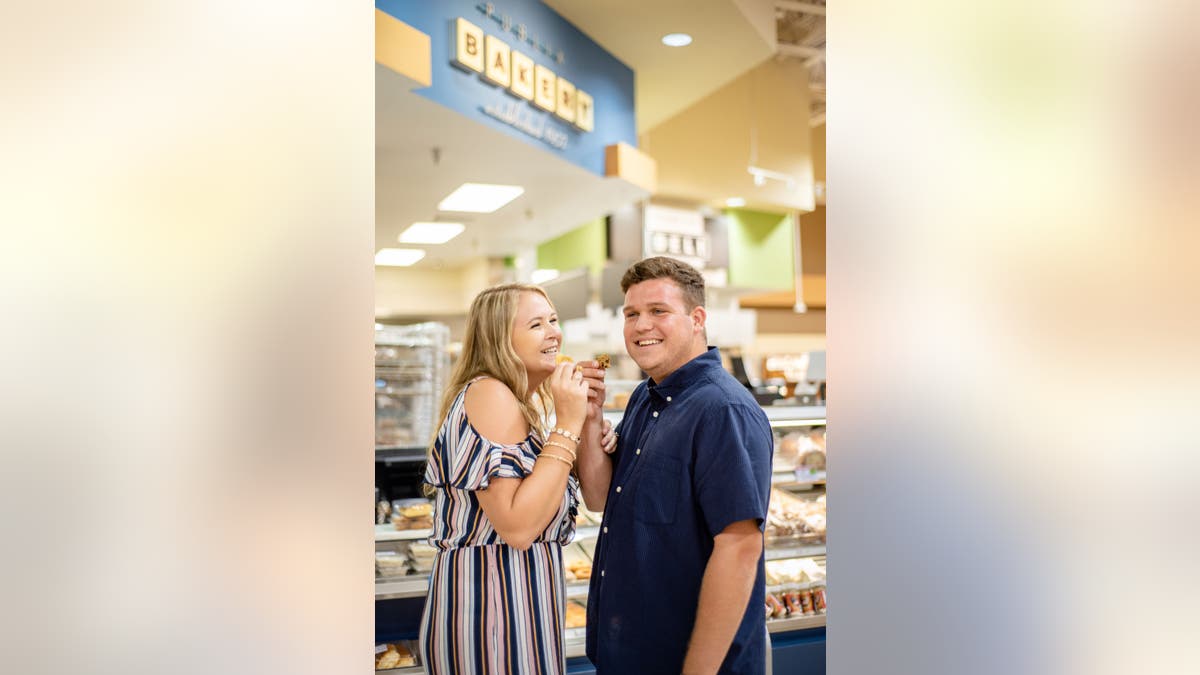 In the series of sweet pictures, the couple smooched behind a freezer door, rode a shopping cart and, of course, sampled Publix's legendary cookies.