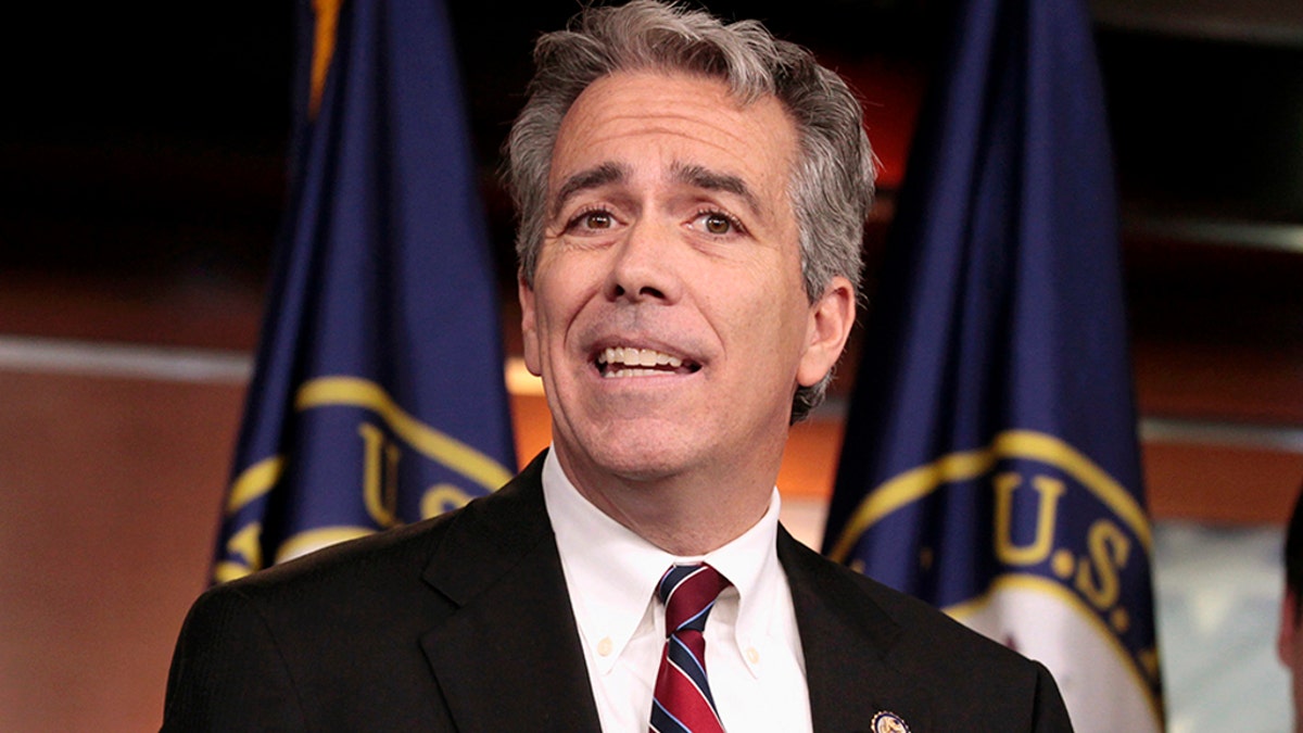 FILE - In this Nov. 15, 2011, file photo former U.S. Rep. Joe Walsh, R-Ill., gestures during a news conference on Capitol Hill in Washington. (AP Photo/Carolyn Kaster, File)