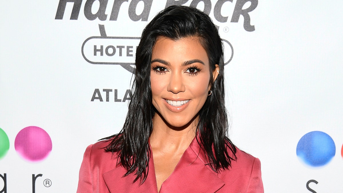 Kourtney Kardashian is hitting back at a critic who appeared surprised that she was spending time with her kids.