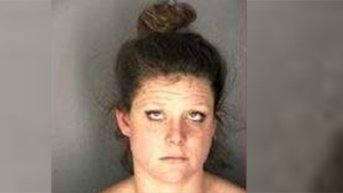 Melody Mellon, 30, was arrested for allegedly stealing a man's dog while he was having a seizure, police said.