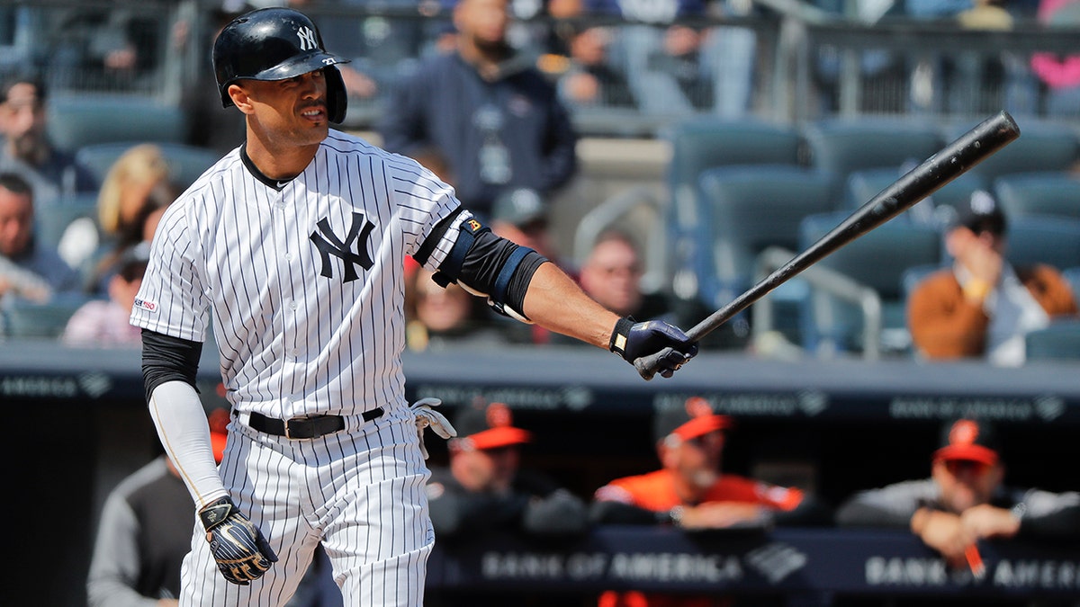 FILE - In this Saturday, March 30, 2019 file photo, New York Yankees right fielder Giancarlo Stanton waits for the pitch against the Baltimore Orioles during the fourth inning of a baseball game in New York. (AP Photo/Julie Jacobson, File)