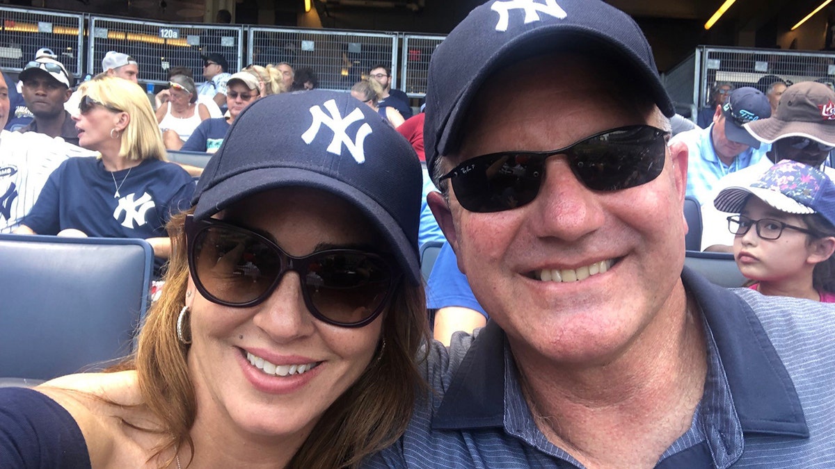 Marty Bailey, right, with his wife Sara Carter attending a game between the New York Yankees and Cleveland Indians.