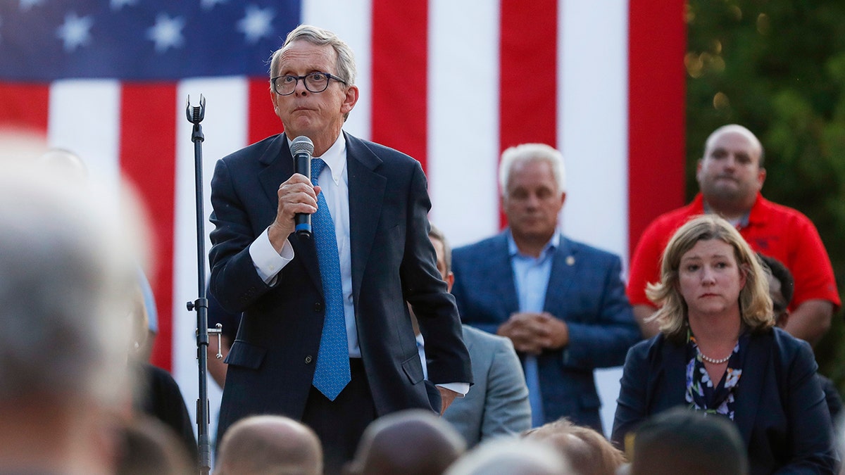 Ohio Gov. Mike DeWine, left, speaks alongside Dayton Mayor Nan Whaley, right, during a vigil at the scene of a mass shooting, Sunday, Aug. 4, 2019, in Dayton, Ohio. (Associated Press)