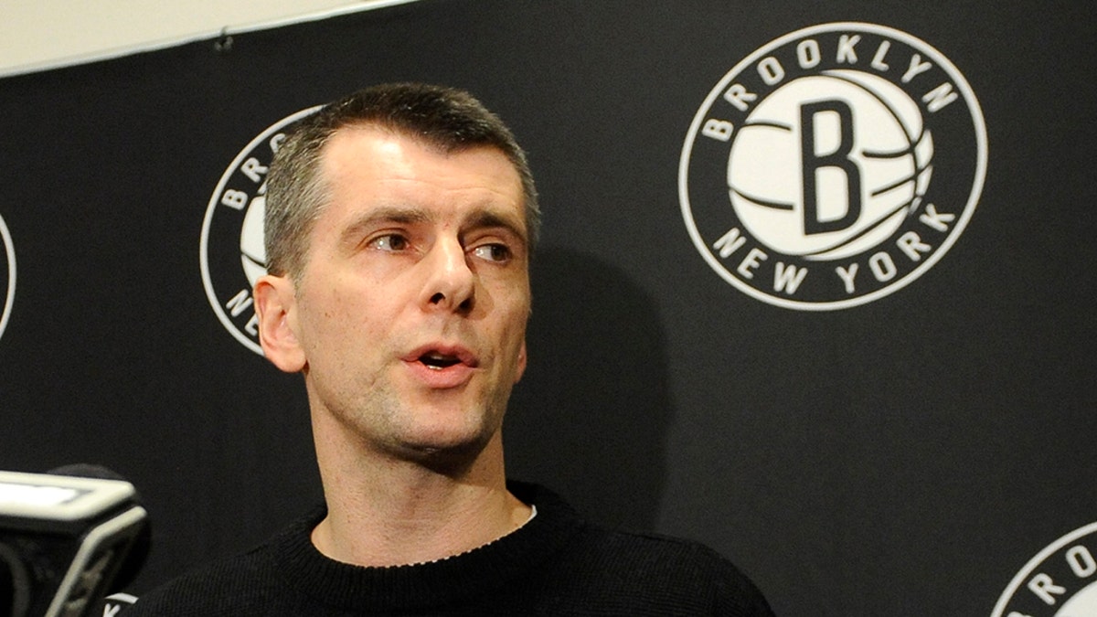 Brooklyn Nets principal owner Mikhail Prokhorov speaks to the media concerning the firing of head coach Avery Johnson. Prokhorov spoke at half time of an NBA basketball game against the Charlotte Bobcats on Friday, Dec., 28, 2012 at Barclays Center in New York. (AP Photo/Kathy Kmonicek)