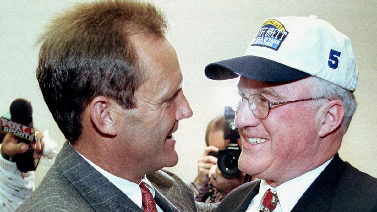 Former Kansas City Royals baseball player George Brett is congratulated by Miles Prentice after Brett was voted into the National Baseball Hall of Fame by the Baseball Writers' Association of America. Prentice nearly bought the Royals. (Photo credit should read DAVID KAUP/AFP/Getty Images)