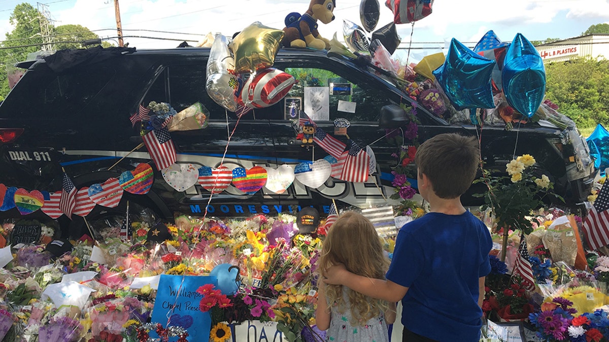 Officer Sheldon's police cruiser was decorated after his death.