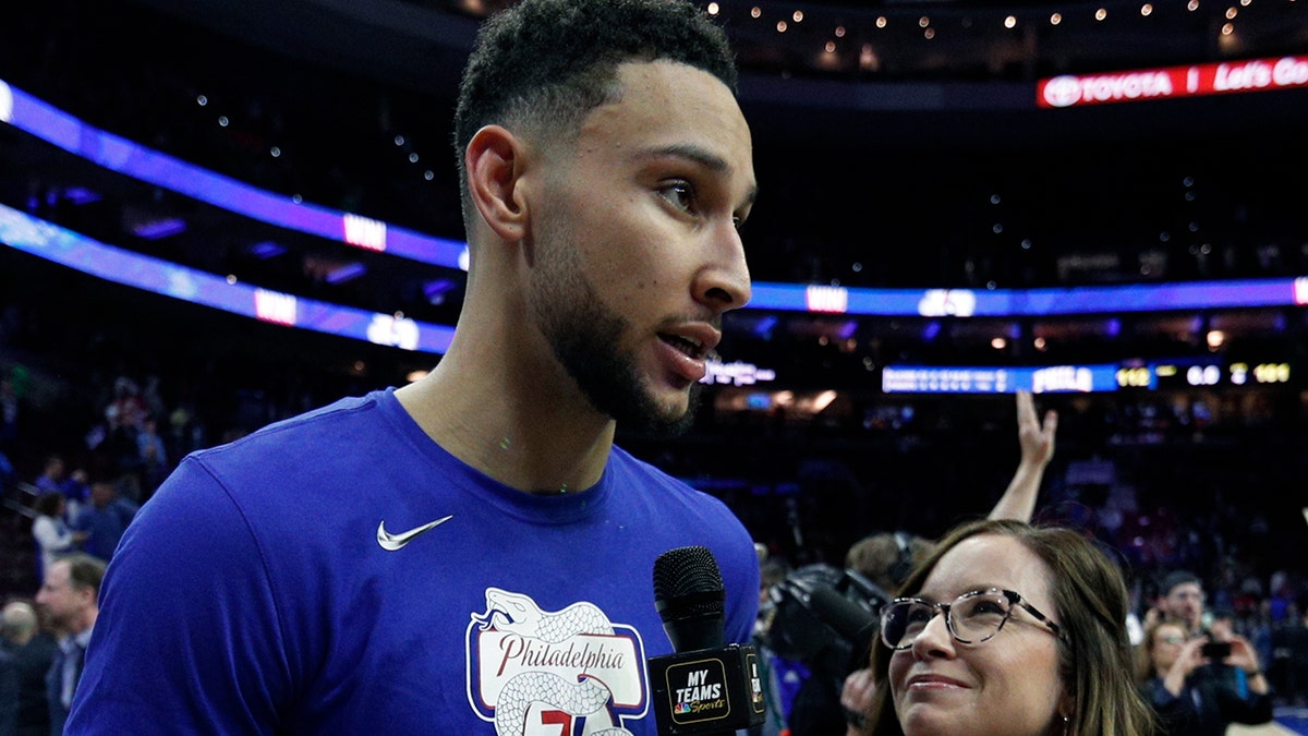 FILE - In this May 9, 2019, file photo, Philadelphia 76ers' Ben Simmons interviewed by 76ers sideline reporter Serena Winters following the second half of Game 6 of a second-round NBA basketball playoff series against the Toronto Raptors, in Philadelphia. (AP Photo/Chris Szagola, File)