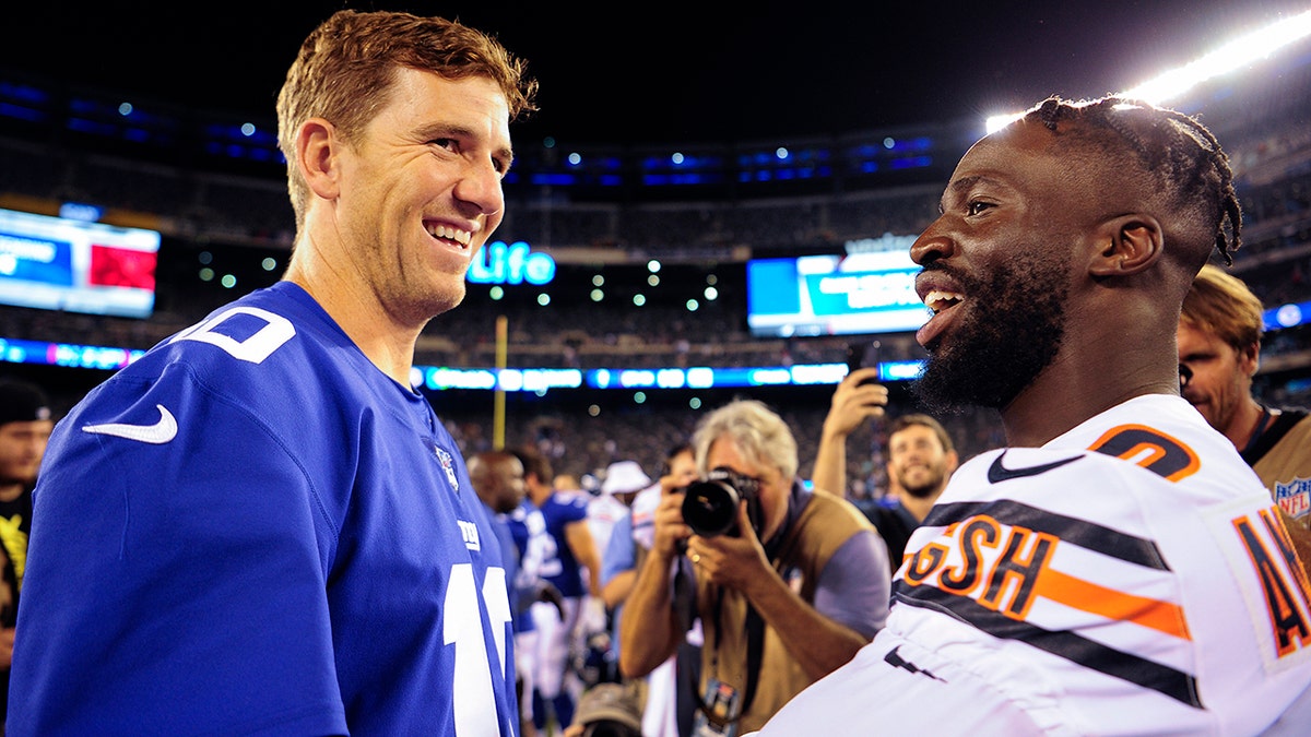 New York Giants quarterback Eli Manning (10) greets Chicago Bears cornerback Prince Amukamara (20) after a preseason NFL football game, Friday, Aug. 16, 2019, in East Rutherford, N.J. The Giants won 32-13.(AP Photo/Sarah Stier)