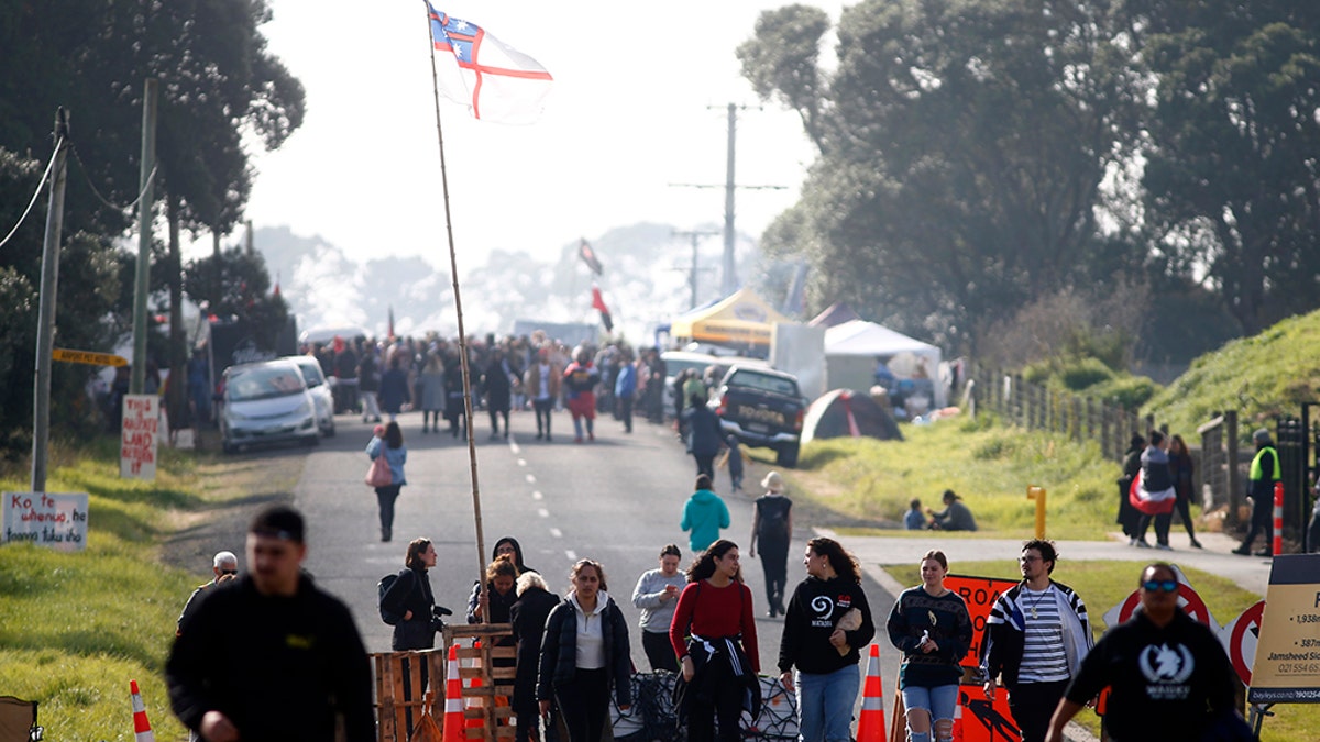 Protestors gather at Ihumātao as they stand to fight a proposed Fletcher Building housing development on July 25, 2019 in Auckland, New Zealand. The site near Auckland Airport is due to be developed by Fletcher Building but has been the subject of a dispute and an occupation after an eviction notice was served against occupiers earlier in the week.