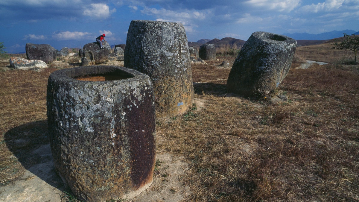 Jars in sandstone in the archaeological site of the Plain of Jars, plateau of Xiang Khoang, Laos.