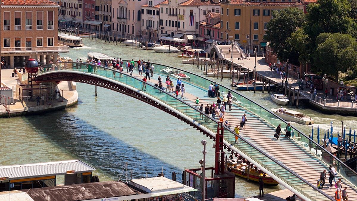 Venice, Italy - June 13, 2013: Venice cityscape and The Constitution Bridge (Ponte della Costituzione) over the Grand canal from above.