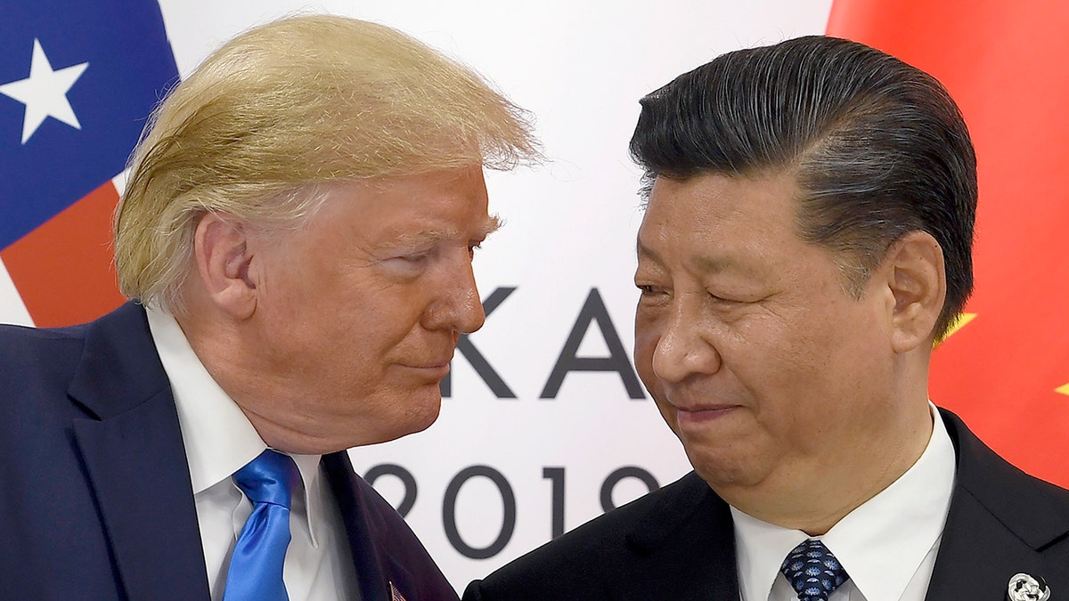 Trump shakes hands firmly with Xi Jinping