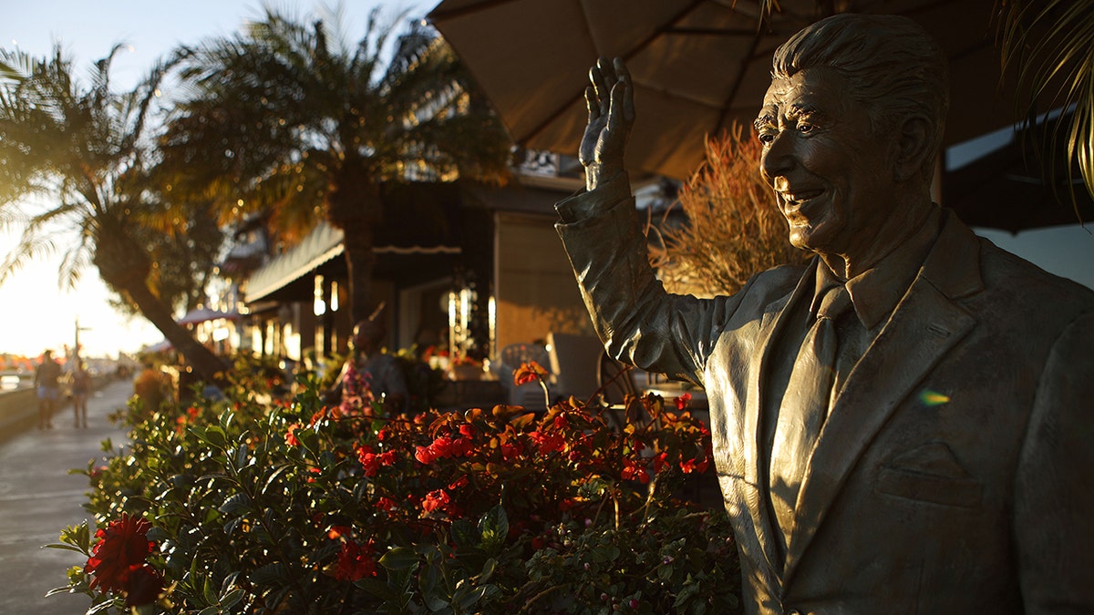 A statue of former President Ronald Reagan in front of a home on Orange County's Balboa Island in Newport Beach, California, in 2018. (Mario Tama/Getty Images, File)