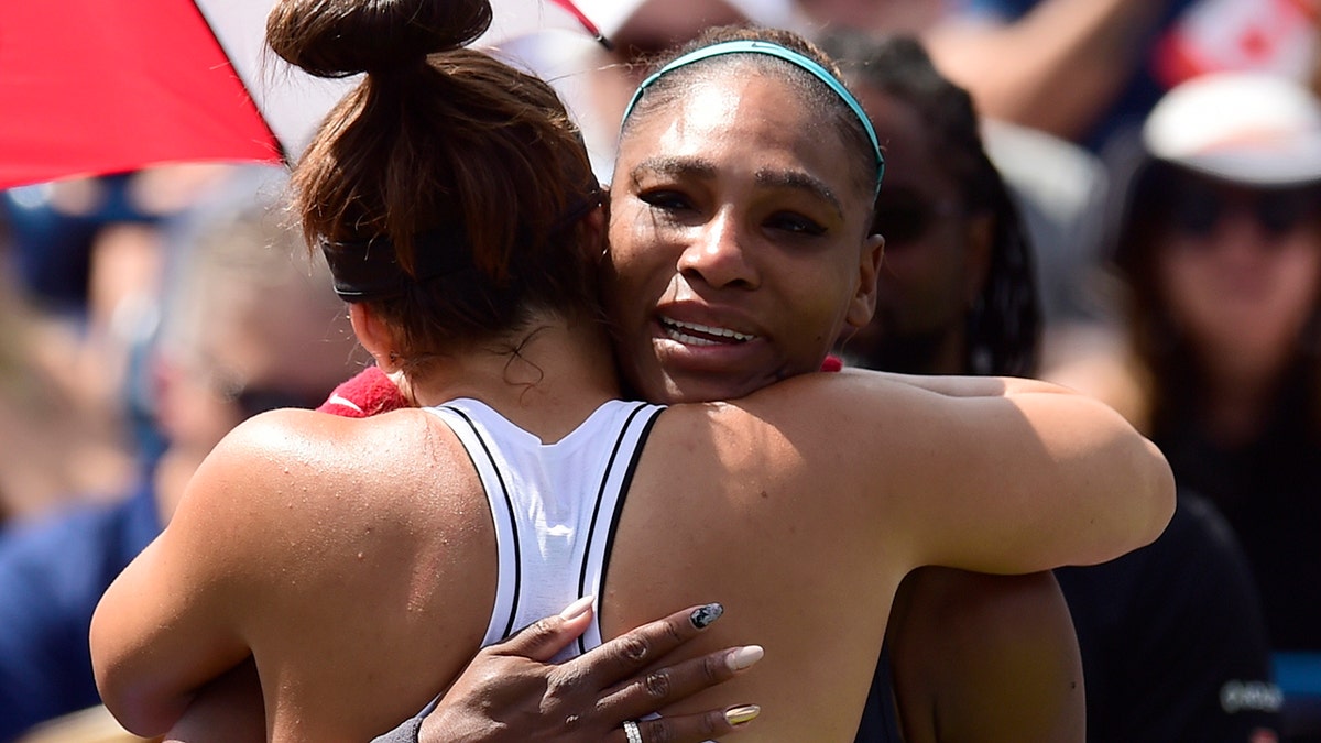 Canada's Bianca Andreescu, left, consoles Serena Williams, of the United States, after Williams had to retire from the final of the Rogers Cup tennis tournament in Toronto, Sunday, Aug. 11, 2019. (Frank Gunn/The Canadian Press via AP)
